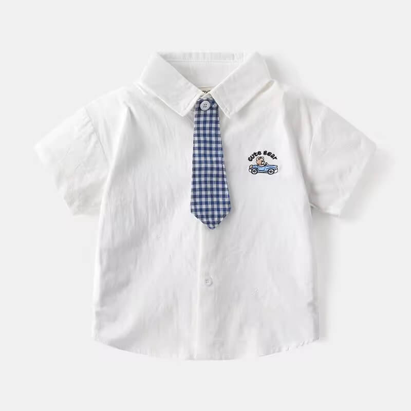 Close-up of baby boy’s checked cotton shirt pattern with matching tie – soft cotton detail