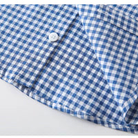 Close-up of fabric texture on baby boy’s checked cotton shirt