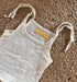 Close-up view of newborn unisex easy wear top emphasizing its minimalist design and soft muslin cotton texture.